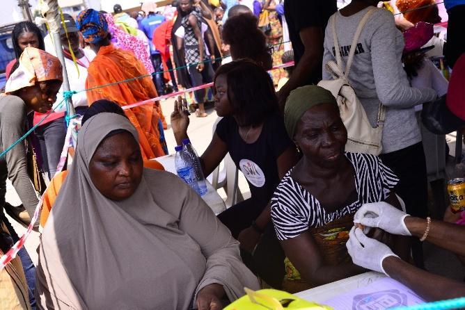 A healthcare worker attending to a community member